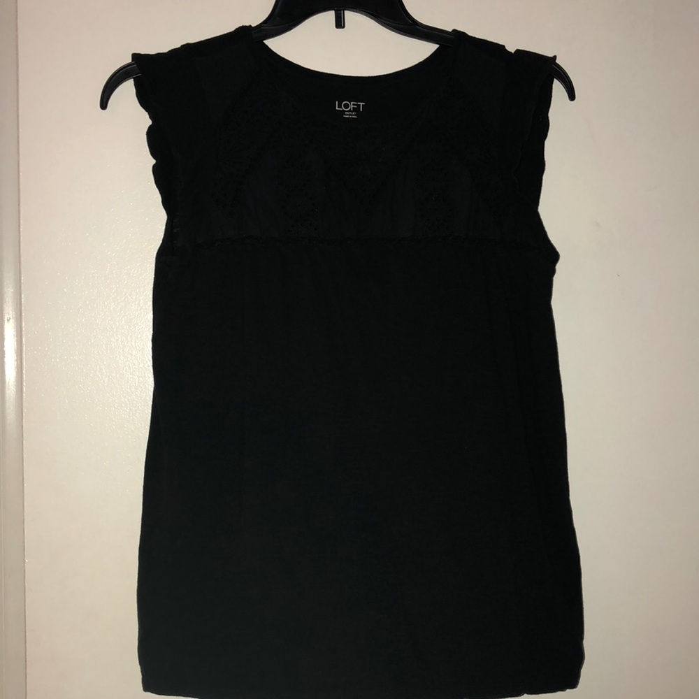 Black loft top with eyelet accents